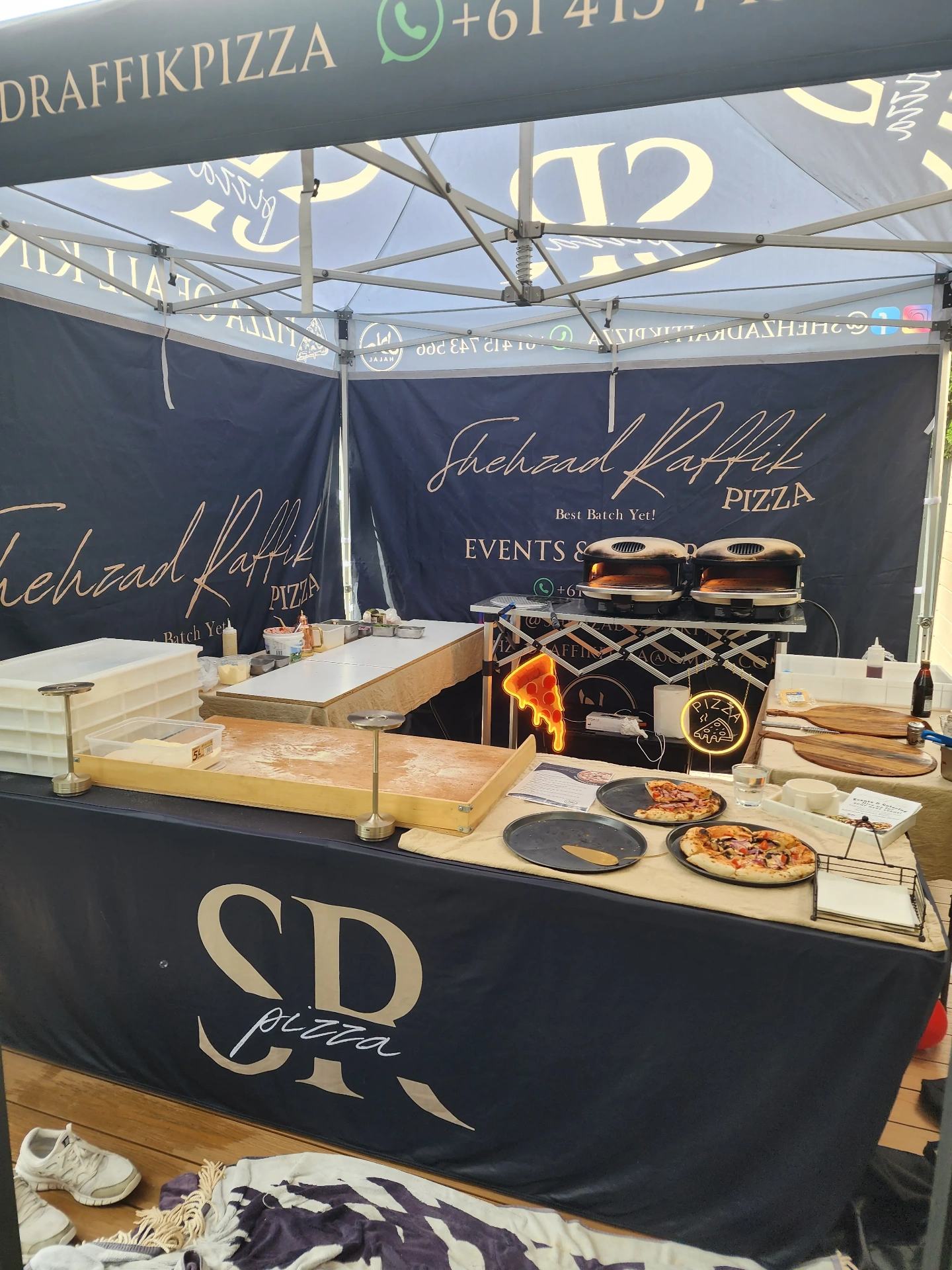 SR Pizza branded catering tent at an event